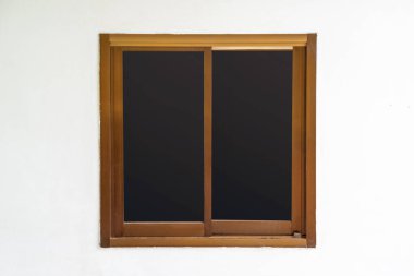 Bronze aluminium door on white concrete wall background. Close-up.