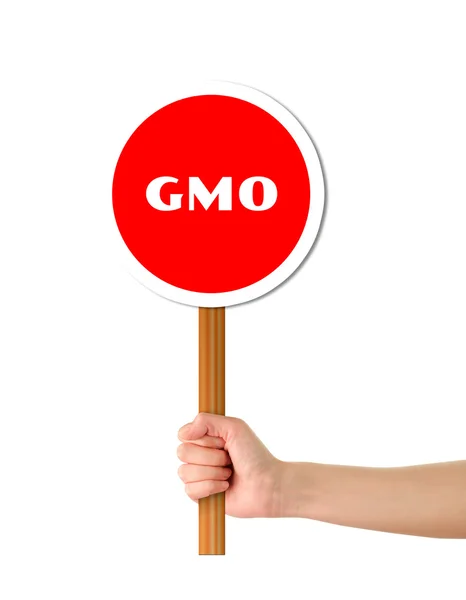 Hand holding red gmo warning sign — Stock Photo, Image