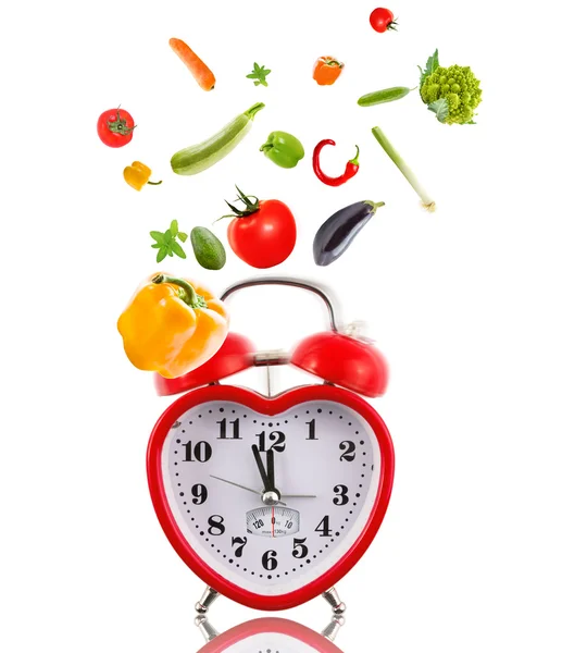 Clock in shape of heart with vegetables. — Stock Photo, Image