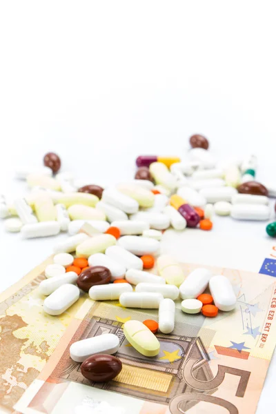 Pile of pills and banknotes closeup with copy-space — Stock Photo, Image