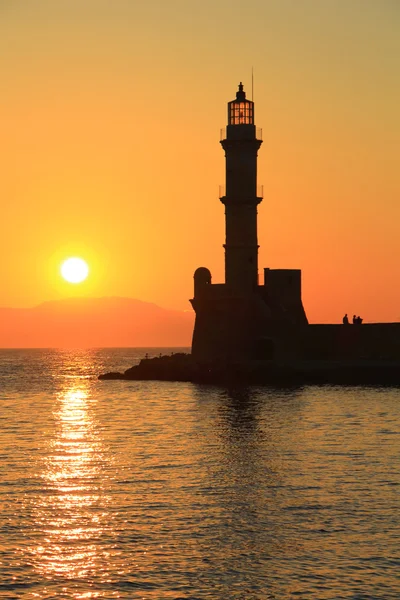 Sunset at harbor with lighthouse Chania Crete