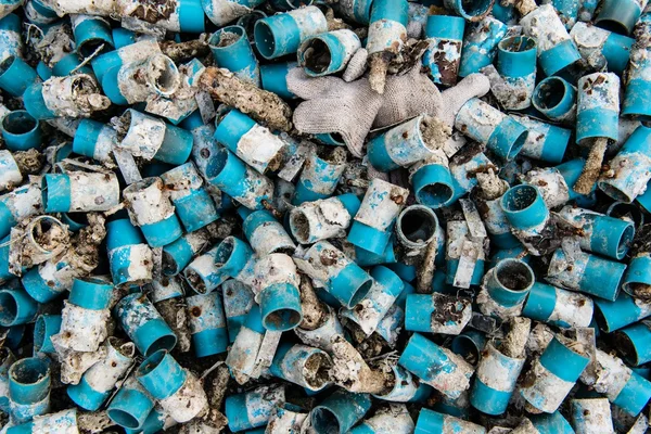 Very dirty blue PVC pipe stack together — Stock Photo, Image