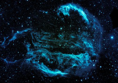Uzayda bir yıldız alanı ve bir nebula