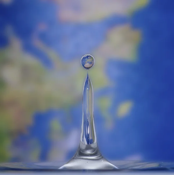 Earth in a drop of water — Stock Photo, Image