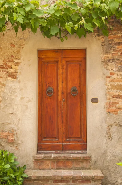 Oude deur, Toscane, Italië Stockfoto