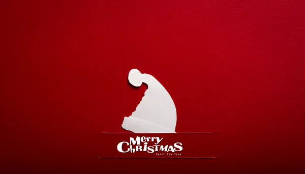 Винтажная рождественская открытка с настоящей бумагой, вырезанной из шляпы Санты — стоковое фото