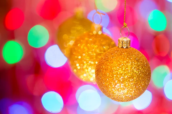 Golden christmas ball on bokeh background Stock Photo