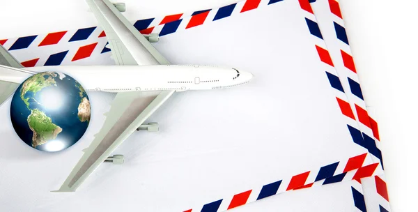 Airmail envelope with model airplane and earth (Elements of this — Stock Photo, Image