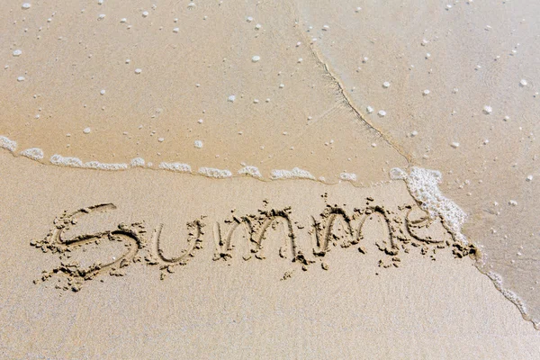 Summer handwritten inscription in sand on a beach — Stock Photo, Image