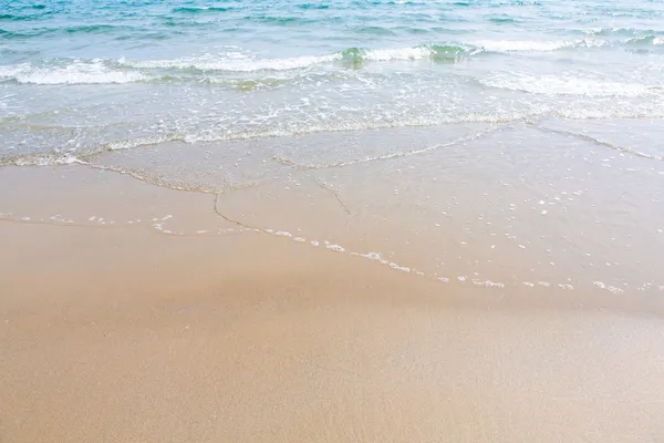 Sandstrand vatten bakgrund — Stockfoto