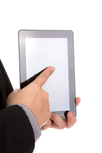 Hombre de negocios usando un dispositivo de pantalla táctil contra fondo blanco — Foto de Stock