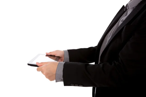 Hombre de negocios usando un dispositivo de pantalla táctil contra fondo blanco — Foto de Stock