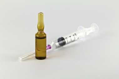 Medical ampoule with solution and disposable syringe isolated on clipart