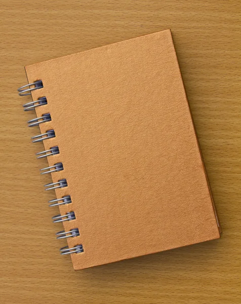 Cuaderno sobre fondo de madera — Foto de Stock