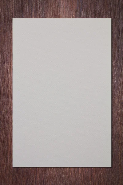 White paper on wood wall — Stock Photo, Image