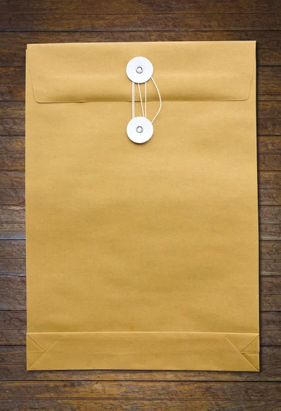 Paper Envelope on wood wall — Stock Photo, Image