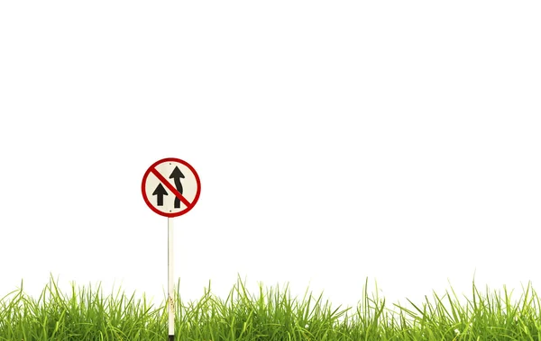 Traffic sign and fresh spring green grass isolated on white back — Stock Photo, Image