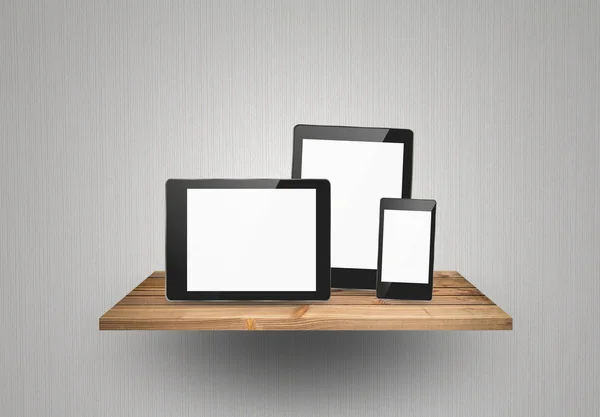Touch screen device on wood shelf — Stock Photo, Image