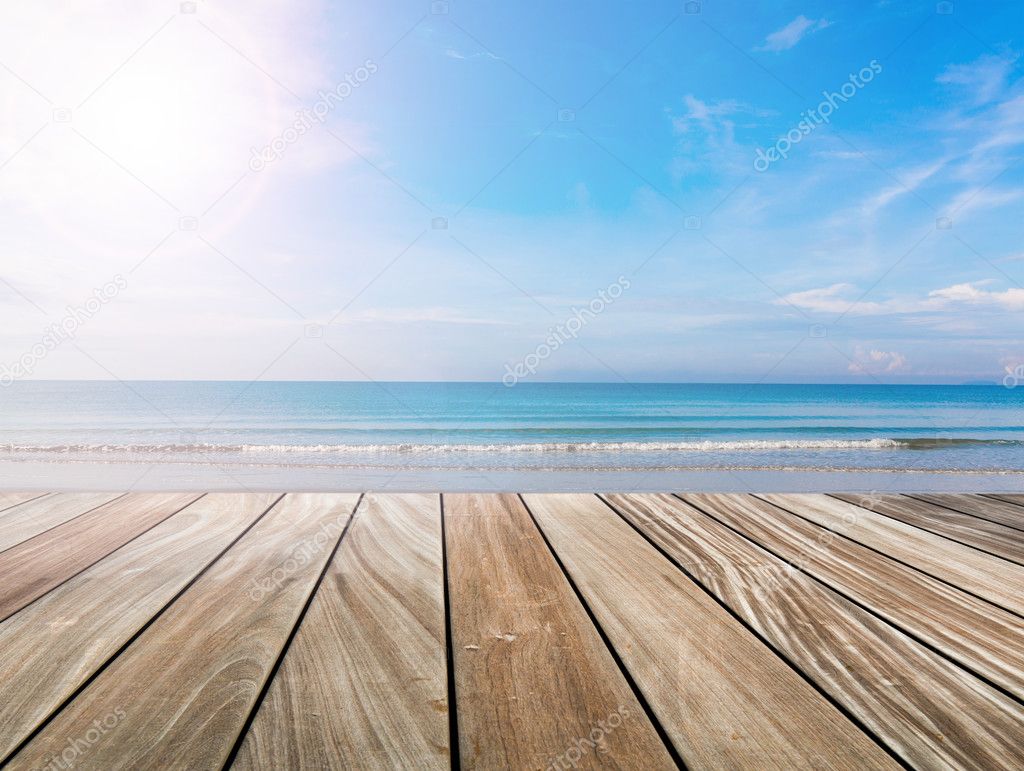 wood terrace on the beach and sun light