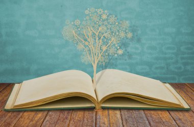 kağıt üzerinde eski kitap kar taneleri ile Noel ağacının kes