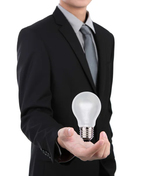 Business man with light bulb against white background — Stock Photo, Image