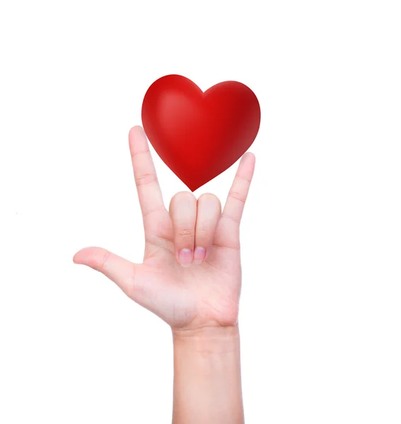 Červené srdce v ruce žena — Stock fotografie