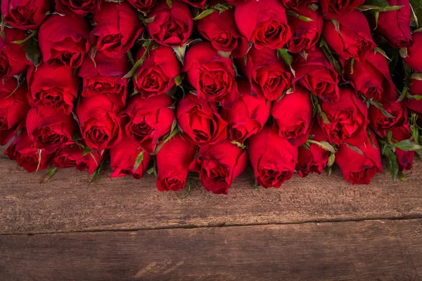 Rose on wooden background — Stock Photo, Image