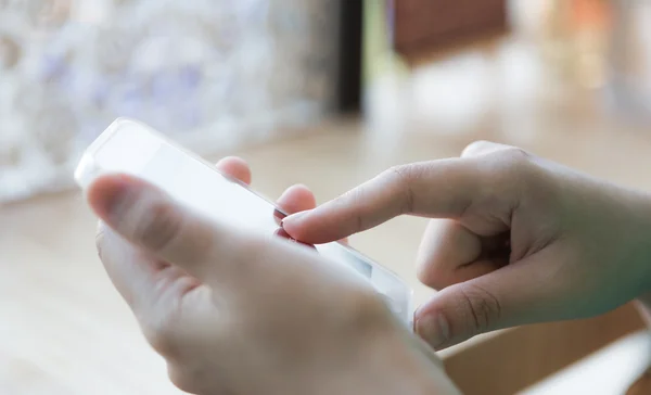 Hands holding and pointing on Smart Phone — Stock Photo, Image