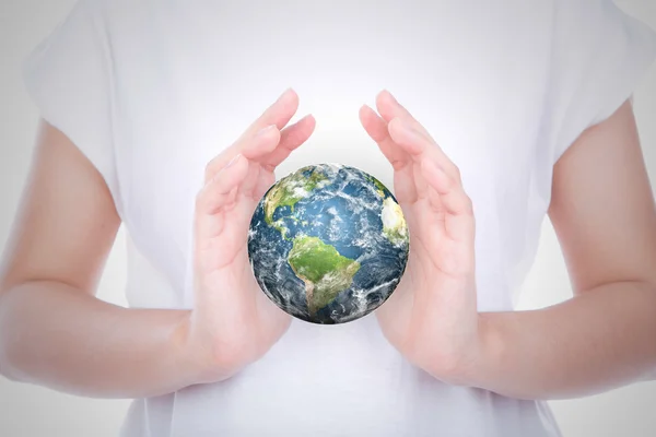 Hands with earth (Elements of this image furnished by NASA) — Stock Photo, Image