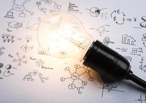 Light bulb with drawing graph — Stock Photo, Image