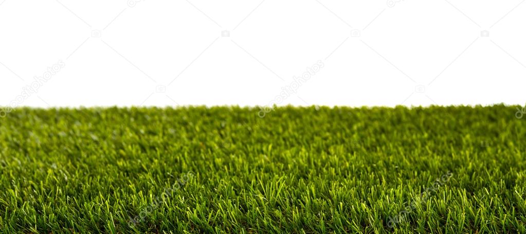 Artificial Fresh spring green grass panorama isolated on white b