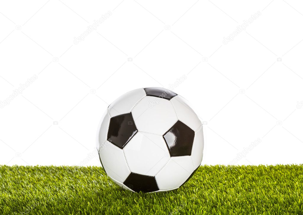 Soccer ball on grass on white background