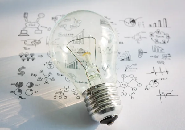 Light bulb with drawing graph — Stock Photo, Image