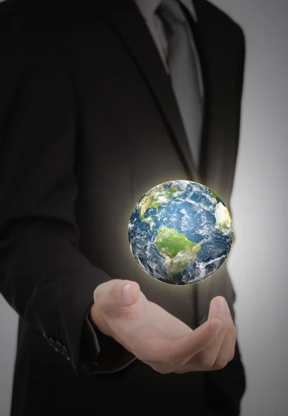 Business man holding earth in his hand (Elements of this image f — Stock Photo, Image