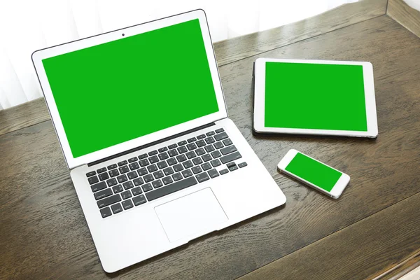 Laptop with tablet and smart phone on table — Stock Photo, Image