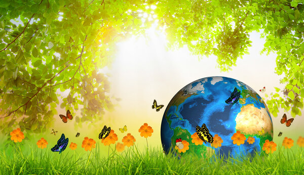 Green Earth on Fresh spring green grass with green leaf and butt