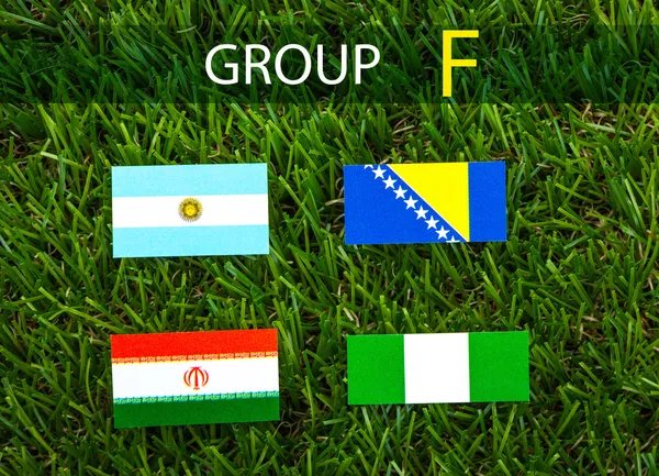 Papier knippen van vlaggen op gras voor voetbal kampioenschap 2014, groep — Stockfoto