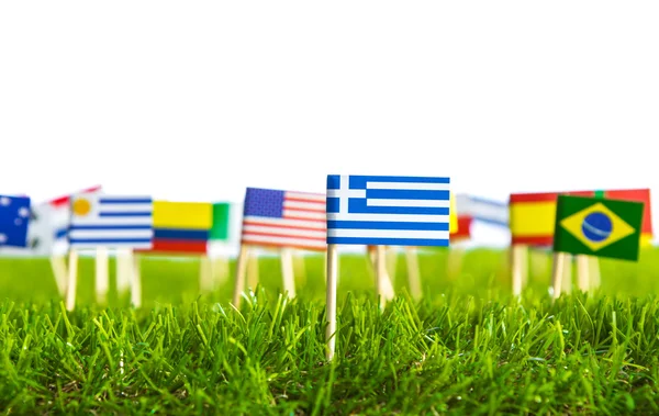 Corte de papel de banderas en césped para el campeonato de fútbol 2014 — Foto de Stock