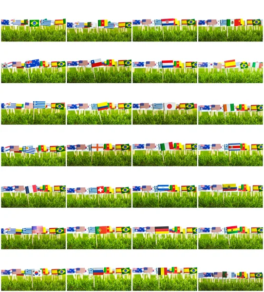 Corte de papel de bandeiras na grama para o campeonato de futebol 2014 — Fotografia de Stock