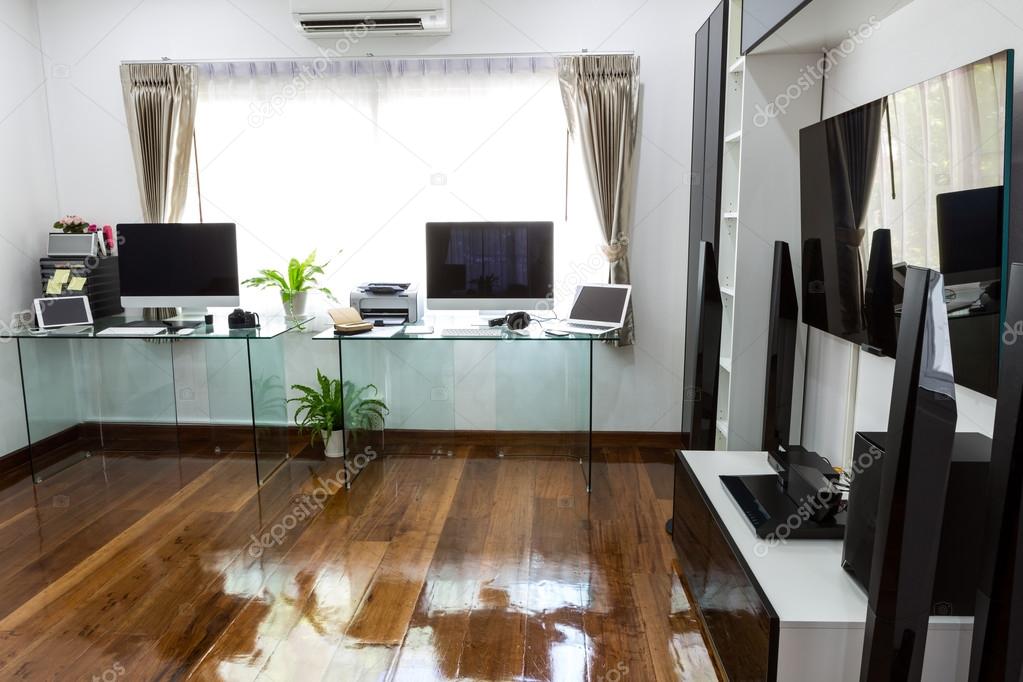 Modern office with computer and labtop with home theater
