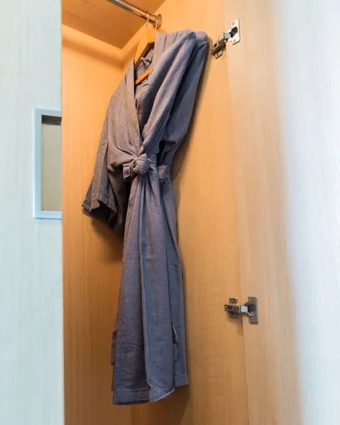 Close up of bathrobe in wardrobe — Stock Photo, Image