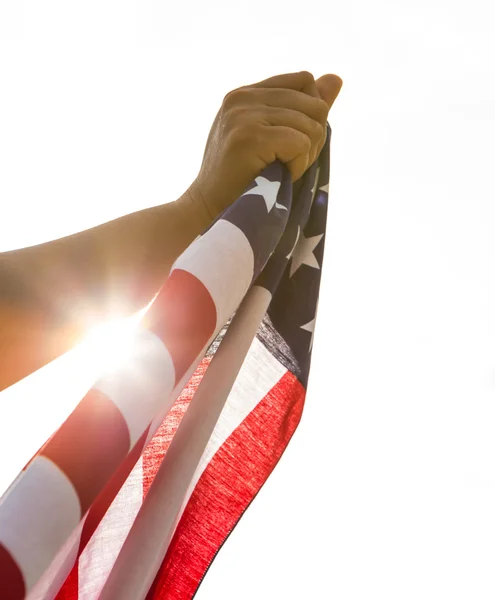 Hand hold American flag with sun light — Stock Photo, Image