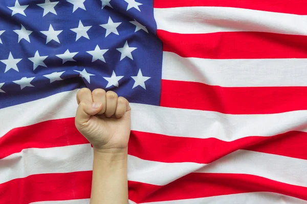Hand over American flag — Stock Photo, Image