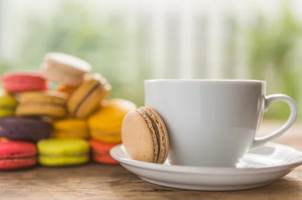 French colorful macarons with cup of coffee — Stock Photo, Image