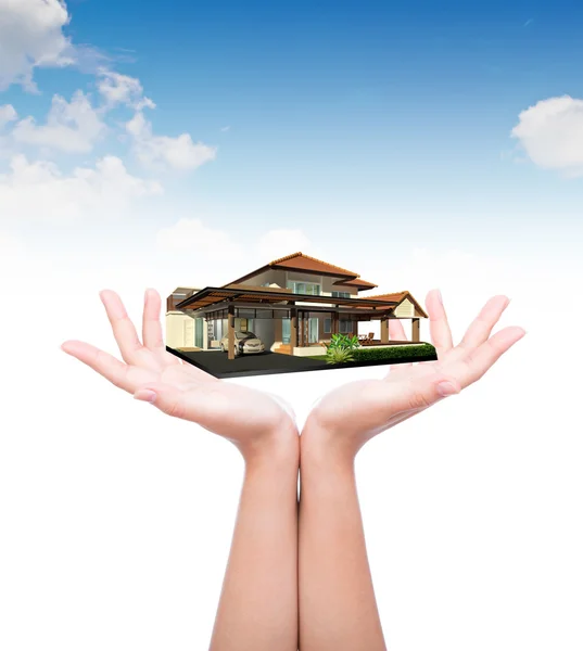 House in human hand over blue sky — Stock Photo, Image