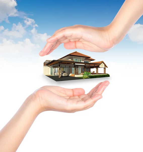 House in human hand over blue sky — Stock Photo, Image