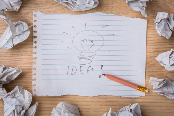 Hand drawn light bulb on paper with Crumpled paper — Stock Photo, Image