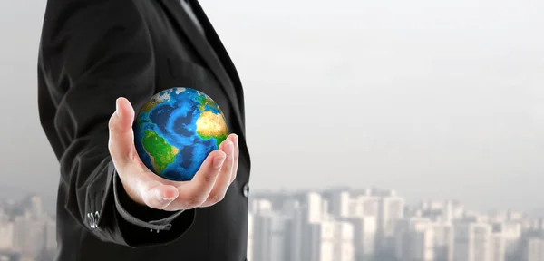 Business man holding the small world in his hand (Elements of th — Stock Photo, Image