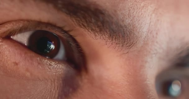 Close-up of a young man, eyes look at the monitor, work with a computer, laptop — Stock Video