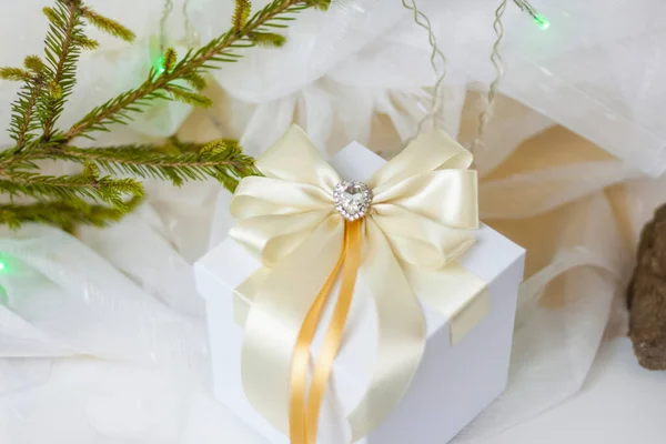 Christmas Gift Decorated Beautiful Bow Light Background Twig Selective Focus — Stock Photo, Image